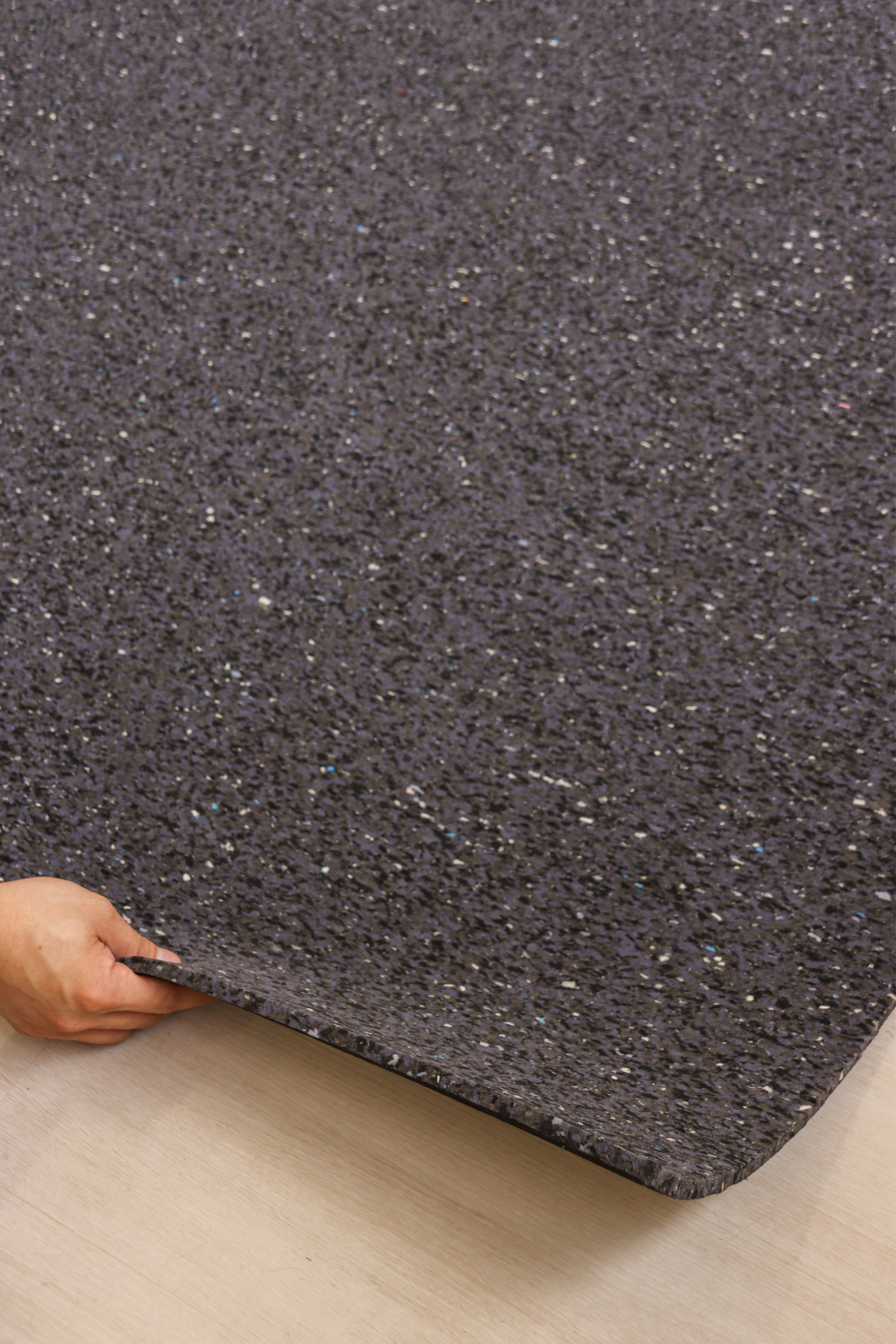 hand holding to a carpet underlay
