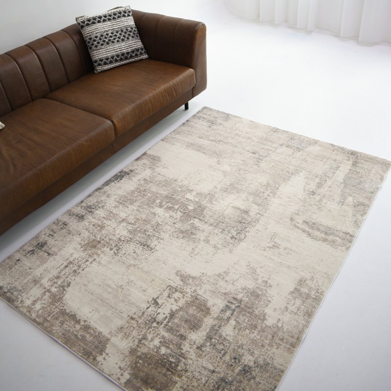 Enhance your room with this blue and cream modern carpet, a medallion design that adds charm to any room.