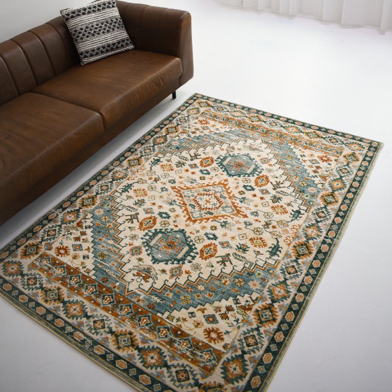 An intricately designed rug with teal, rust, and beige accents. Perfect for adding a vibrant touch to any room.