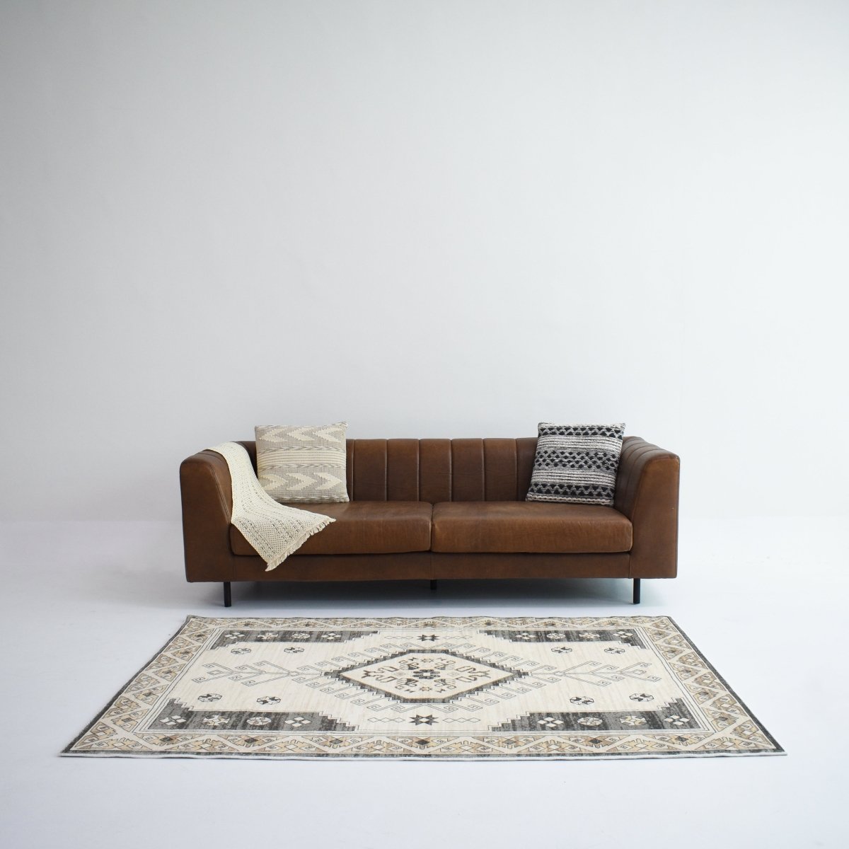 This neutral-toned carpet with a striking geometric design adds character and warmth to any modern or rustic space.