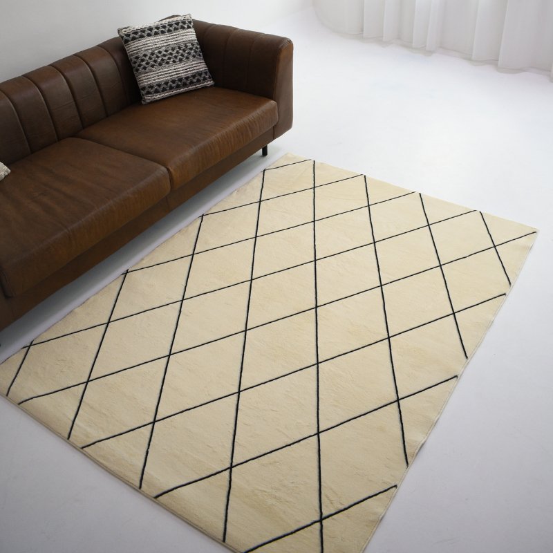 This cream carpet with a subtle black geometric pattern adds modern elegance and simplicity to any space