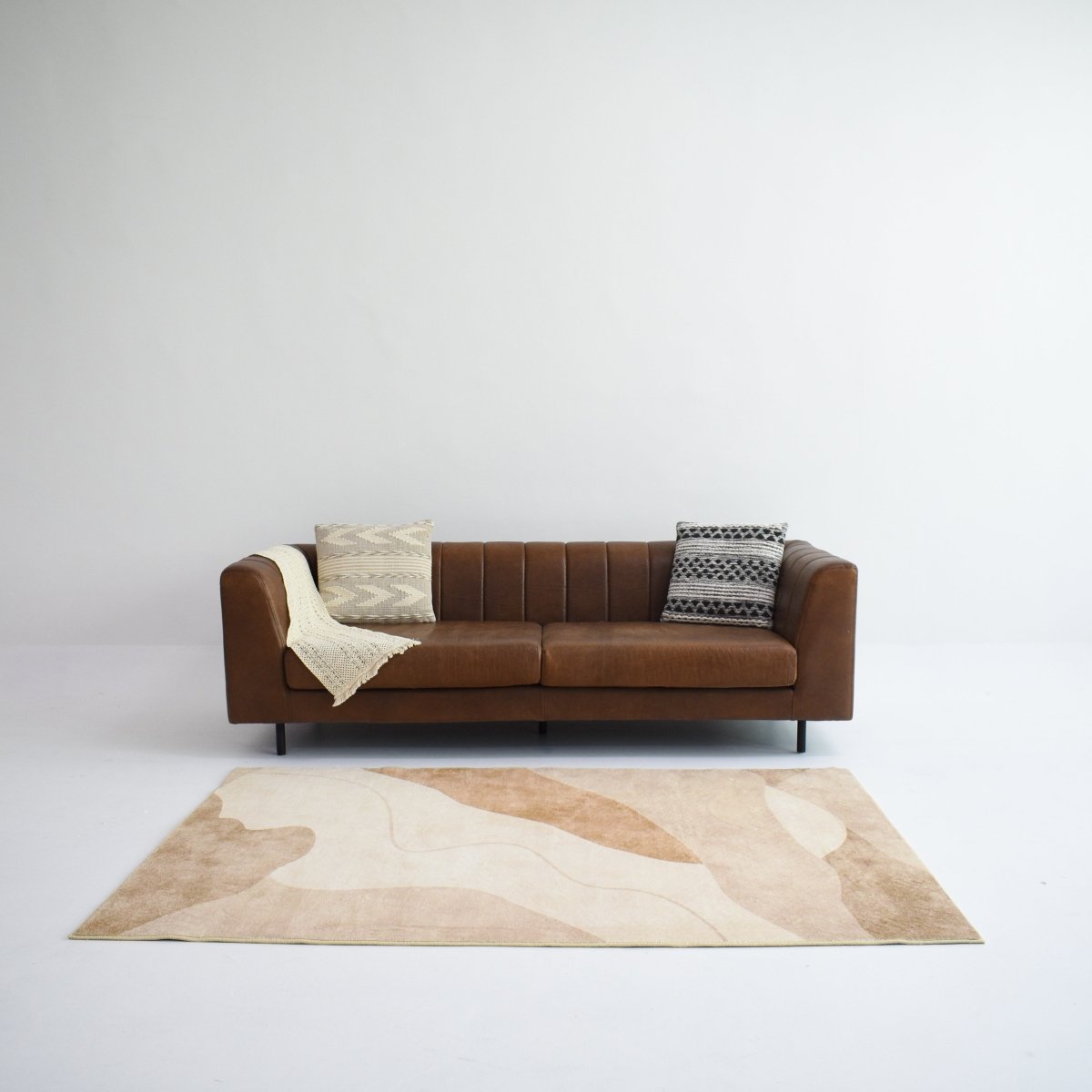 Transform your space with this beige and brown carpet featuring an wave design. Perfect for adding warmth to interiors.